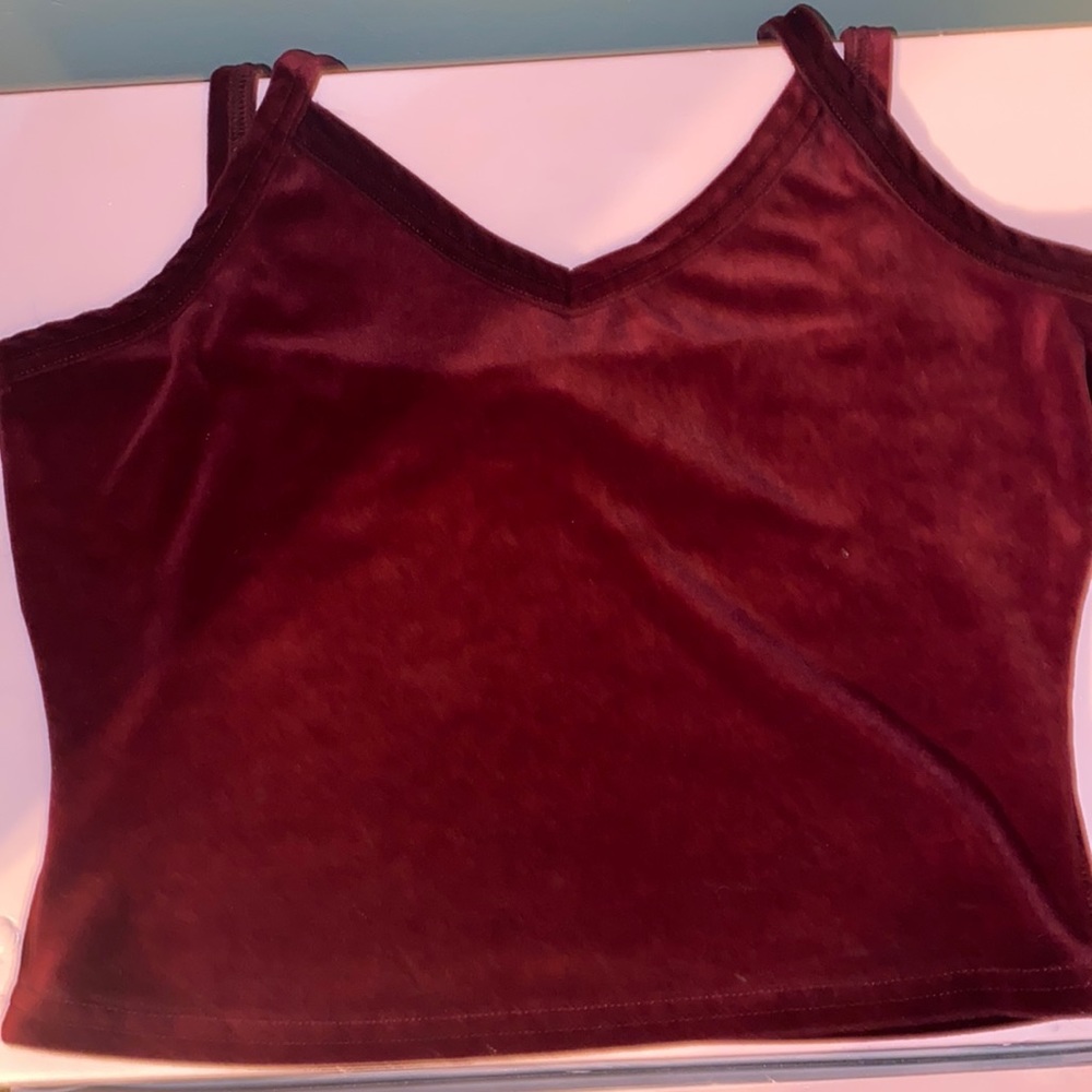 E.Y.E brand it’s a deep burgundy and velvet